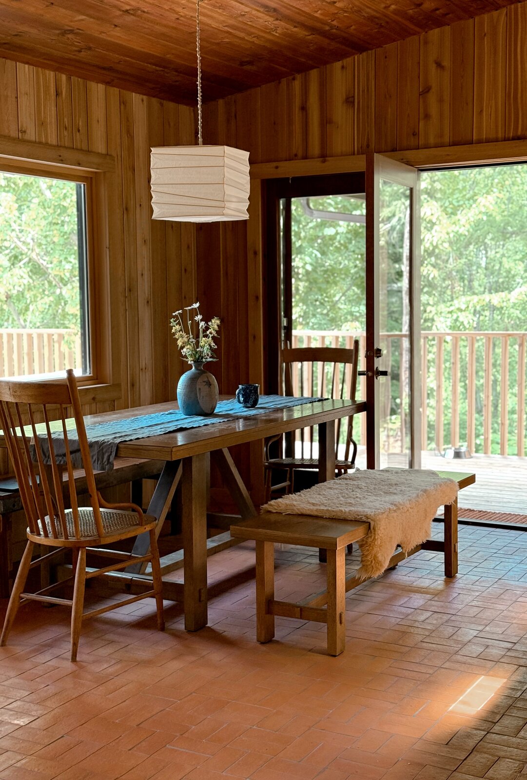 Dining room with paper lantern and deck door