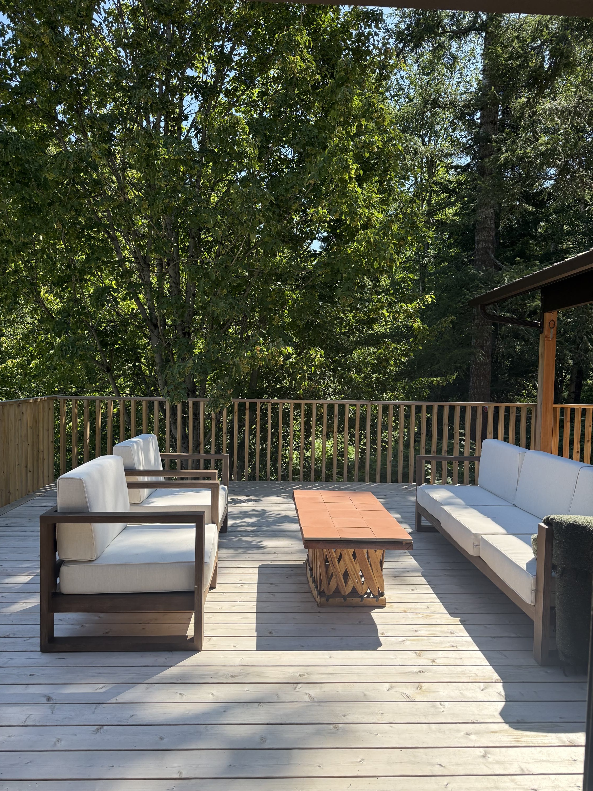 Outdoor sofa and armchairs on the deck